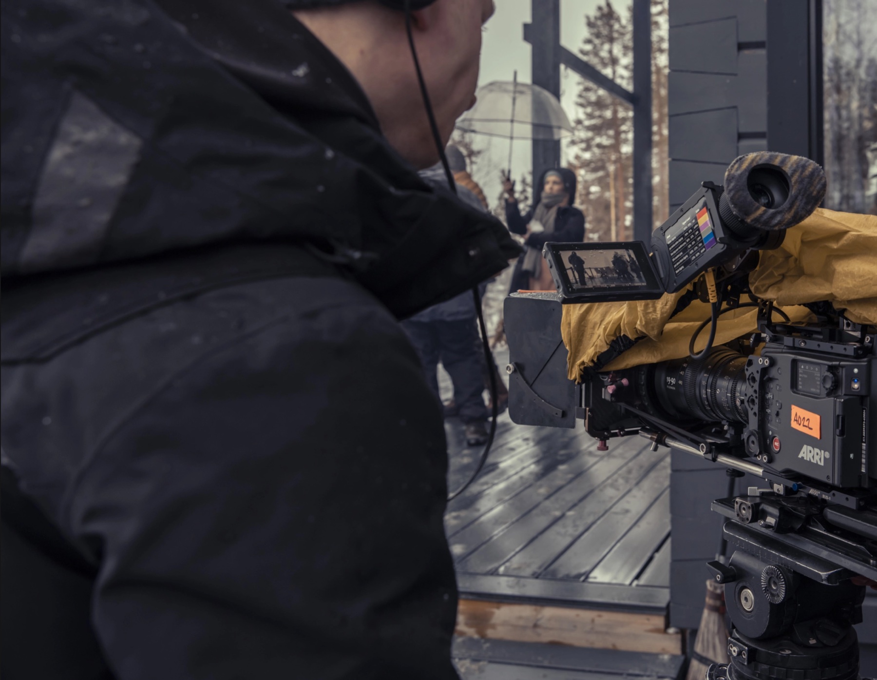 A film crew operating a cinema camera on location.